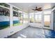 Bright sunroom with water views, ready for furniture at 17744 1St E St, Redington Shores, FL 33708