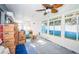 Sunroom with large windows and ceiling fan, ready to be furnished at 17744 1St E St, Redington Shores, FL 33708
