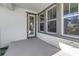 Back patio with gray concrete flooring and windows at 1810 32Nd N Ave, St Petersburg, FL 33713