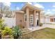 Two-story house with white columns and front yard at 1912 W Jean St, Tampa, FL 33604