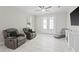 Relaxing living room featuring two leather recliners and a large TV at 1912 W Jean St, Tampa, FL 33604