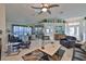 Open living space with a view into the kitchen and dining areas at 1943 S Pebble Beach Blvd, Sun City Center, FL 33573