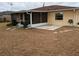 Backyard view of home with screened patio and stepping stones at 237 Orduna Dr, North Port, FL 34287