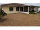 Home features a screened porch and a spacious backyard at 237 Orduna Dr, North Port, FL 34287