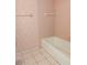 Pink tiled bathroom with a bathtub at 237 Orduna Dr, North Port, FL 34287