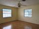 Spacious bedroom featuring hardwood flooring and dual windows at 237 Orduna Dr, North Port, FL 34287