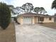 House exterior with a driveway and landscaping at 237 Orduna Dr, North Port, FL 34287