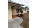 The home has a covered entryway and a tiled porch at 237 Orduna Dr, North Port, FL 34287