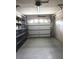 Attached garage with shelving for additional storage at 237 Orduna Dr, North Port, FL 34287