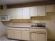Efficient kitchen with ample cabinetry and a microwave at 237 Orduna Dr, North Port, FL 34287