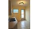 Kitchen with double sink and exterior access at 237 Orduna Dr, North Port, FL 34287