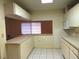 Kitchen features a breakfast bar and built-in microwave at 237 Orduna Dr, North Port, FL 34287