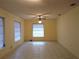 Bright living room with tile flooring and ceiling fan at 237 Orduna Dr, North Port, FL 34287