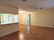 Bright living room with hardwood floors and a kitchen pass-through at 237 Orduna Dr, North Port, FL 34287