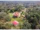 Aerial view of a home with pool and detached garage on a large lot at 249 Dogwood Trce, Tarpon Springs, FL 34688