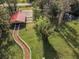 Aerial view of property showing riding path and barn at 249 Dogwood Trce, Tarpon Springs, FL 34688