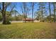 Rustic barn with white fence in background at 249 Dogwood Trce, Tarpon Springs, FL 34688