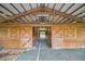 Empty stalls in a rustic barn at 249 Dogwood Trce, Tarpon Springs, FL 34688