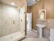 Bathroom with pedestal sink and walk-in shower at 249 Dogwood Trce, Tarpon Springs, FL 34688