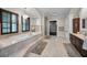 Spa-like bathroom with soaking tub, walk-in shower, and dual vanities at 249 Dogwood Trce, Tarpon Springs, FL 34688