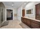 Bathroom with vanity, walk-in shower, and access to another room at 249 Dogwood Trce, Tarpon Springs, FL 34688
