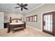 Spacious bedroom with king-size bed and private door access at 249 Dogwood Trce, Tarpon Springs, FL 34688