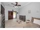 Bedroom with dresser, couch and door to outside at 249 Dogwood Trce, Tarpon Springs, FL 34688