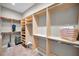 Large walk-in closet with custom shelving and rods at 249 Dogwood Trce, Tarpon Springs, FL 34688