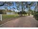 Metal garage with two garage doors sits on a grassy lot at 249 Dogwood Trce, Tarpon Springs, FL 34688