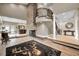 Grand two-story foyer with a stone fireplace and winding staircase at 249 Dogwood Trce, Tarpon Springs, FL 34688