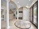 Entryway with columns, a circular rug and views to other rooms at 249 Dogwood Trce, Tarpon Springs, FL 34688