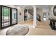 Elegant entryway with columns, a circular rug and staircase at 249 Dogwood Trce, Tarpon Springs, FL 34688