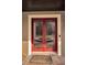 Double red front doors with glass panels and a welcome mat at 249 Dogwood Trce, Tarpon Springs, FL 34688