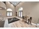 Game room with a pool table, large windows, and a comfortable seating area at 249 Dogwood Trce, Tarpon Springs, FL 34688
