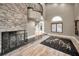 Spacious game room with stone fireplace, large windows, and a pool table at 249 Dogwood Trce, Tarpon Springs, FL 34688