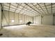 Spacious garage interior with room for a jet ski at 249 Dogwood Trce, Tarpon Springs, FL 34688
