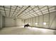 Spacious garage interior with room for a jet ski at 249 Dogwood Trce, Tarpon Springs, FL 34688
