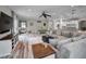 Open concept Gathering room features a large sectional sofa and views into the kitchen at 249 Dogwood Trce, Tarpon Springs, FL 34688