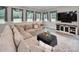 Relaxing Gathering room with sectional sofa, large TV, and ample natural light at 249 Dogwood Trce, Tarpon Springs, FL 34688