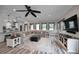 Bright and airy Gathering room features a large sectional sofa and wood-look floors at 249 Dogwood Trce, Tarpon Springs, FL 34688