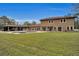 Two-story house with pool and outdoor kitchen at 249 Dogwood Trce, Tarpon Springs, FL 34688