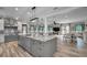Open kitchen boasts stainless steel appliances and a large center island at 249 Dogwood Trce, Tarpon Springs, FL 34688