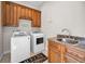 Laundry room with washer, dryer, and cabinets at 249 Dogwood Trce, Tarpon Springs, FL 34688
