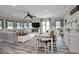 Bright and airy living room with open floor plan and access to backyard at 249 Dogwood Trce, Tarpon Springs, FL 34688