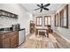 Home office with desk, coffee station, and wood floors at 249 Dogwood Trce, Tarpon Springs, FL 34688