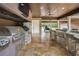 Stainless steel appliances and granite countertop island in outdoor kitchen at 249 Dogwood Trce, Tarpon Springs, FL 34688