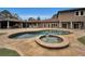 Resort-style pool and spa with expansive patio at 249 Dogwood Trce, Tarpon Springs, FL 34688