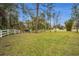 Landscaped yard with pond and fountain at 249 Dogwood Trce, Tarpon Springs, FL 34688