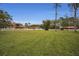 Large grassy yard with main house and barn visible at 249 Dogwood Trce, Tarpon Springs, FL 34688