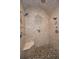 Large walk-in shower with multiple shower heads and pebble floor at 249 Dogwood Trce, Tarpon Springs, FL 34688